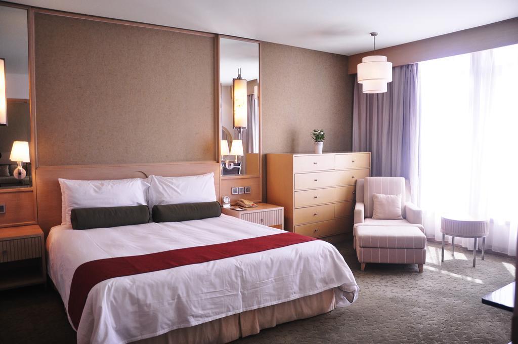 Hotel Nikko Tiencin Zewnętrze zdjęcie A bedroom at the hotel